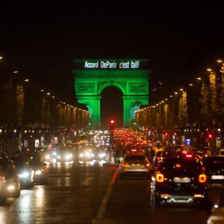 The Arc de Triomphe in France lit in green at night to celebrate the Paris accord.