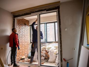 Man doing work on a doorway